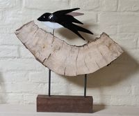 Zwaluw op hout verkocht